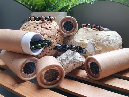 Bracelets and tubes on a wooden surface. Visible text: none. Essential context present.