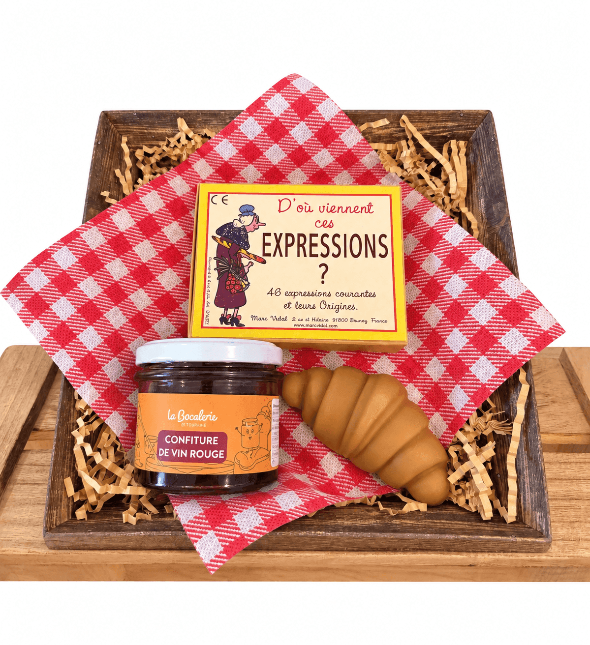 coffret avec un croissant savon , une confiture de vin rouge et et un jeu sur les expressions , d'ici et de claire 